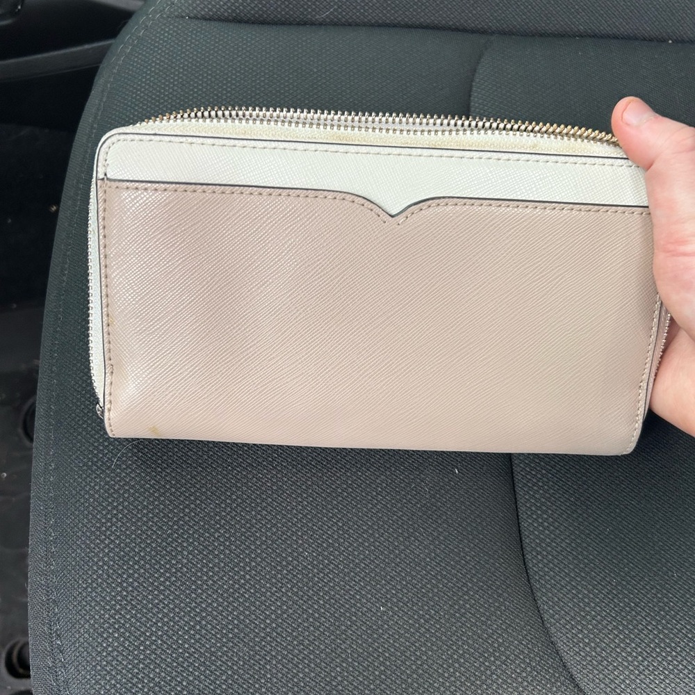 Kate spade wallet only used once! It’s just been sitting in my car! OBO